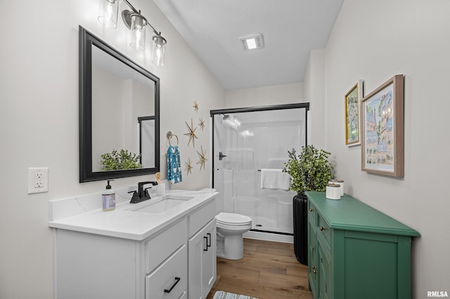 5835 Pigeon Creek Rd, Bettendorf, IA 52722 - bathroom with vanity, wood finished floors, and a shower stall
