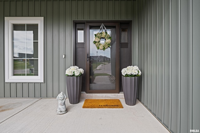 5835 Pigeon Creek Rd, Bettendorf, IA 52722 - doorway to property featuring board and batten siding