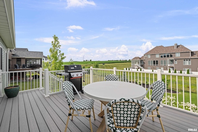 5835 Pigeon Creek Rd, Bettendorf, IA 52722 - wooden terrace featuring grilling area, outdoor dining area, and a yard