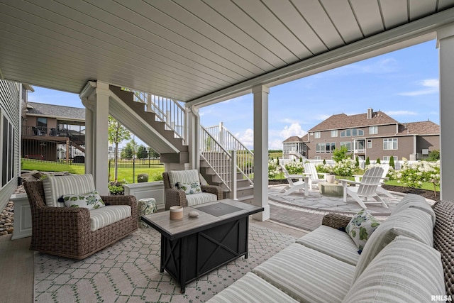 5835 Pigeon Creek Rd, Bettendorf, IA 52722 - view of patio featuring stairs, an outdoor living space with a fire pit, and a residential view
