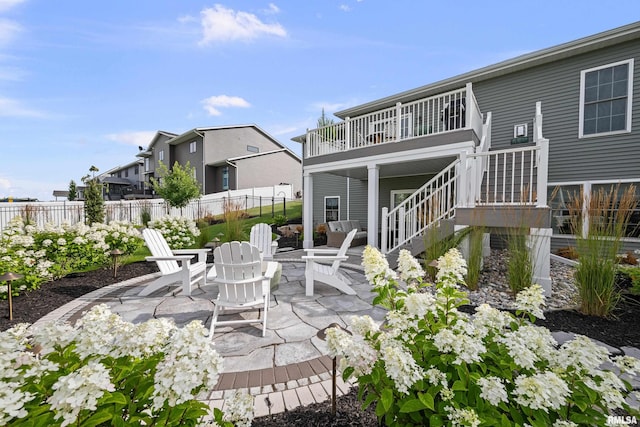 5835 Pigeon Creek Rd, Bettendorf, IA 52722 - view of patio / terrace featuring stairway and a fire pit