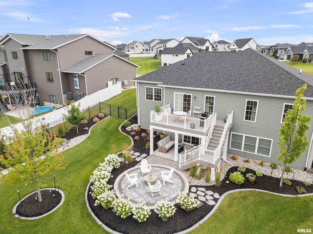 5835 Pigeon Creek Rd, Bettendorf, IA 52722 - rear view of house featuring a shingled roof, a fenced backyard, a residential view, a patio, and a deck