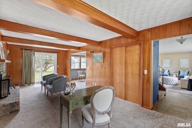 505 N 7th St, Eldridge, IA 52748 - carpeted home office with beam ceiling, wood walls, and a brick fireplace