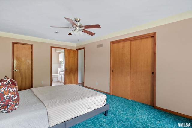 505 N 7th St, Eldridge, IA 52748 - carpeted bedroom with a closet, ensuite bathroom, and a ceiling fan
