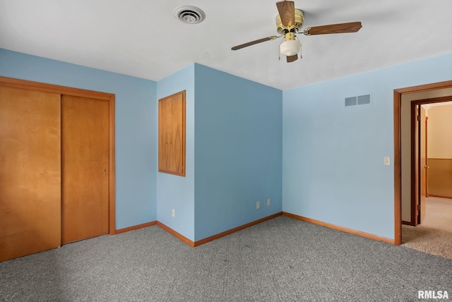 505 N 7th St, Eldridge, IA 52748 - unfurnished bedroom featuring carpet flooring, a closet, and a ceiling fan