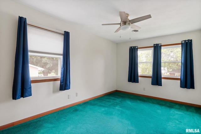 505 N 7th St, Eldridge, IA 52748 - unfurnished room with carpet flooring and ceiling fan
