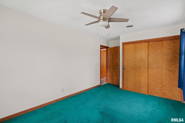 505 N 7th St, Eldridge, IA 52748 - unfurnished bedroom featuring a closet, carpet, and a ceiling fan