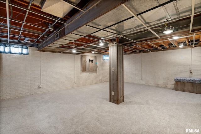 505 N 7th St, Eldridge, IA 52748 - below grade area featuring brick wall and carpet floors