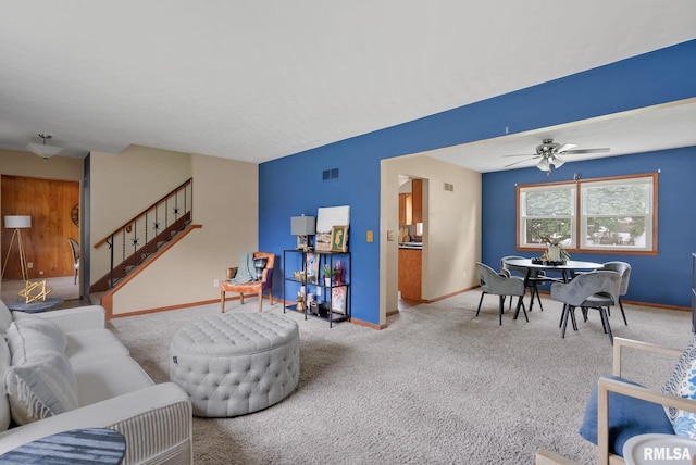 505 N 7th St, Eldridge, IA 52748 - living area with stairs, carpet, and ceiling fan