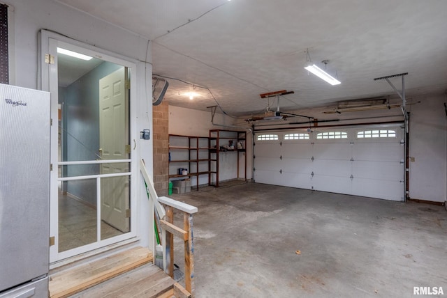 505 N 7th St, Eldridge, IA 52748 - garage featuring a garage door opener