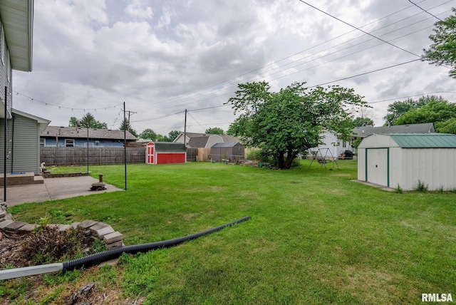 505 N 7th St, Eldridge, IA 52748 - fenced backyard featuring a shed and a patio area