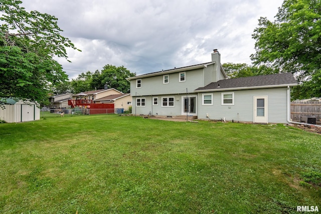 505 N 7th St, Eldridge, IA 52748 - back of house featuring a shed, a patio, and a chimney