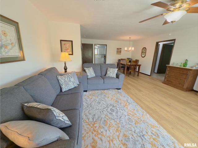 3715 35th St Unit 3, Moline, IL 61265 - living room with light wood-type flooring, a chandelier, and ceiling fan