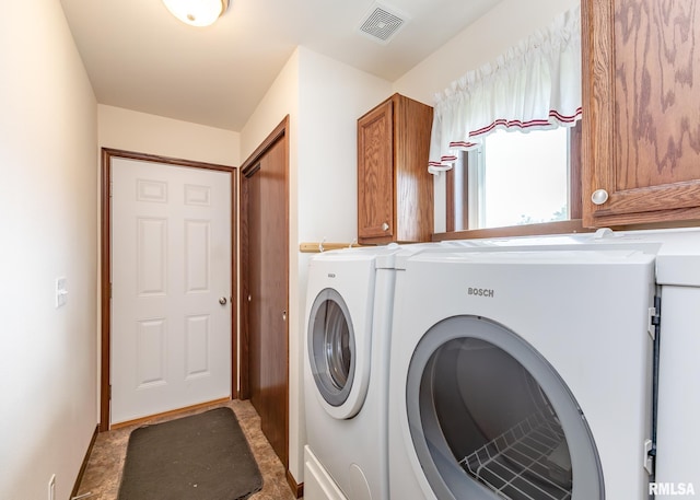95 N 18th St, Clinton, IA 52732 - laundry room featuring washing machine and dryer and cabinet space