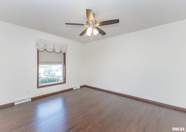 95 N 18th St, Clinton, IA 52732 - empty room featuring a ceiling fan and dark wood-style floors