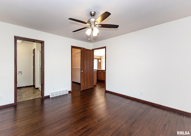 95 N 18th St, Clinton, IA 52732 - empty room with ceiling fan and dark wood-style floors