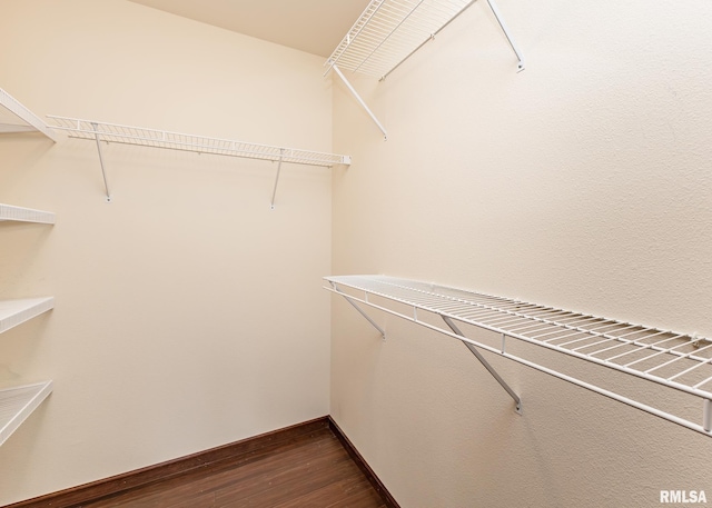 95 N 18th St, Clinton, IA 52732 - spacious closet featuring dark wood finished floors