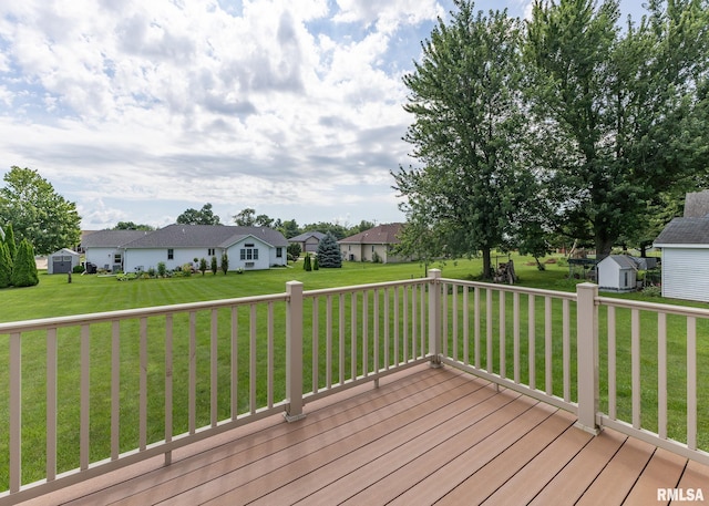 95 N 18th St, Clinton, IA 52732 - wooden terrace with a storage unit, a yard, and a residential view