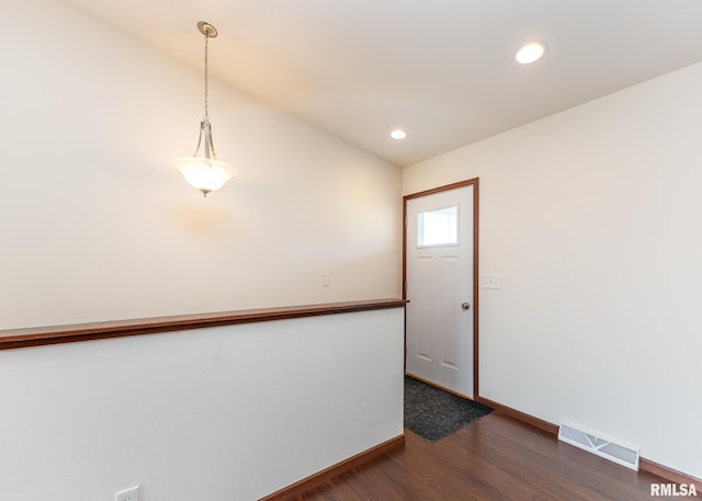 95 N 18th St, Clinton, IA 52732 - foyer entrance with dark wood finished floors, recessed lighting, and vaulted ceiling