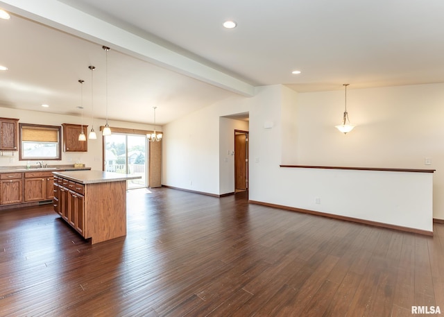95 N 18th St, Clinton, IA 52732 - kitchen with dark wood-style floors, open floor plan, light countertops, decorative light fixtures, and a center island