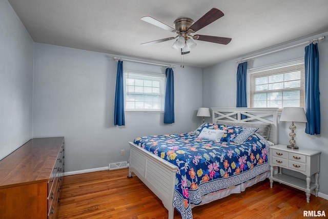 3118 W Denison Ave, Davenport, IA 52804 - bedroom featuring wood finished floors and ceiling fan