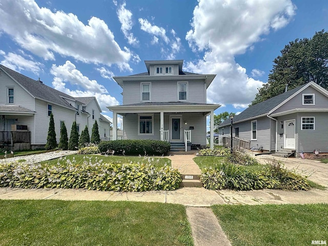 1426 32nd St, Rock Island, IL 61201 - traditional style home featuring entry steps, a porch, and a front lawn