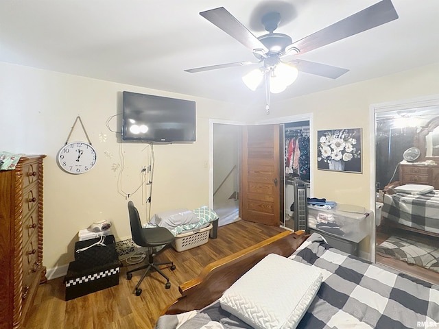 1426 32nd St, Rock Island, IL 61201 - bedroom with wood finished floors, a closet, and ceiling fan