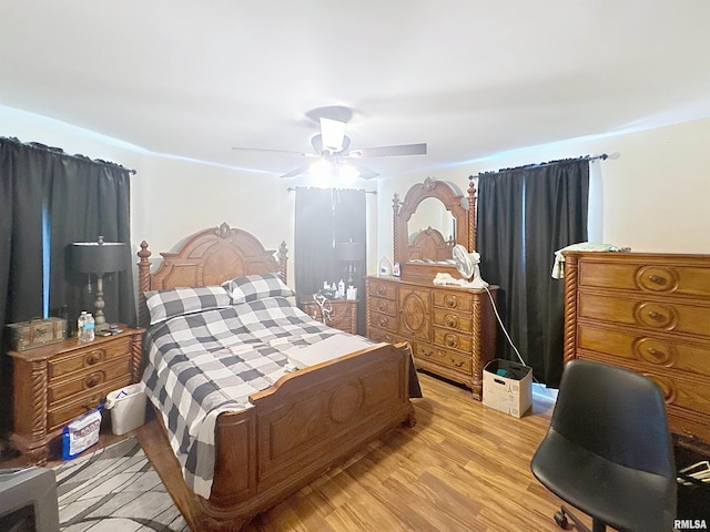 1426 32nd St, Rock Island, IL 61201 - bedroom with light wood finished floors and a ceiling fan