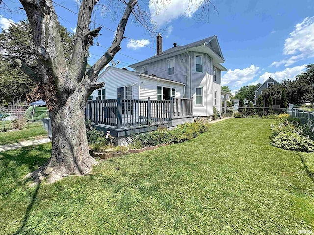 1426 32nd St, Rock Island, IL 61201 - rear view of house with a chimney and a deck