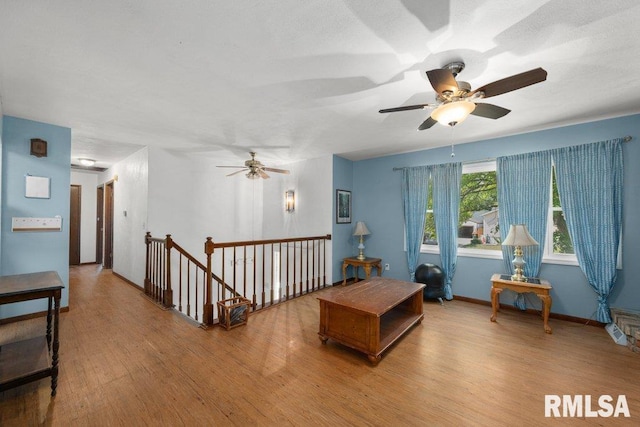 2917 W 65th St, Davenport, IA 52806 - living room with a ceiling fan and wood finished floors