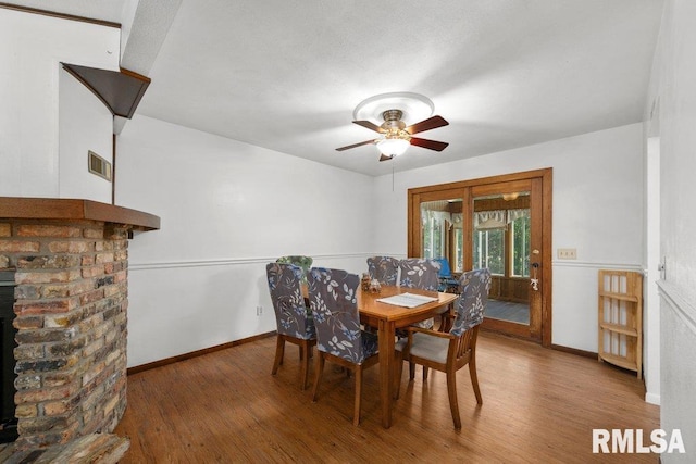 2917 W 65th St, Davenport, IA 52806 - dining space featuring wood finished floors and ceiling fan