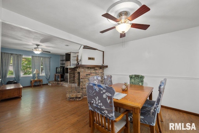 2917 W 65th St, Davenport, IA 52806 - dining space featuring ceiling fan and wood finished floors