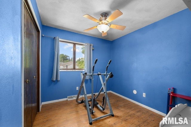 2917 W 65th St, Davenport, IA 52806 - workout room with wood finished floors and ceiling fan