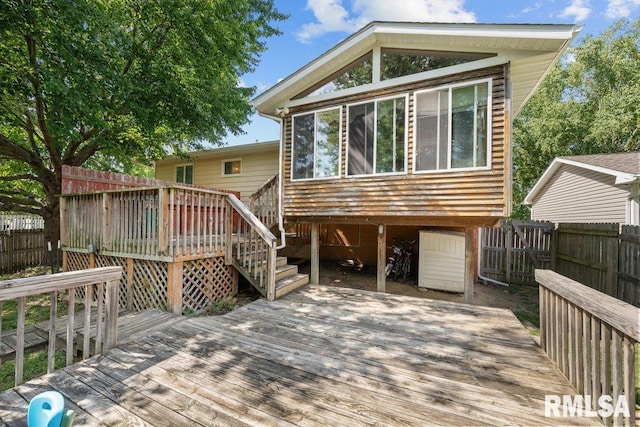 2917 W 65th St, Davenport, IA 52806 - wooden terrace featuring stairs and a fenced backyard