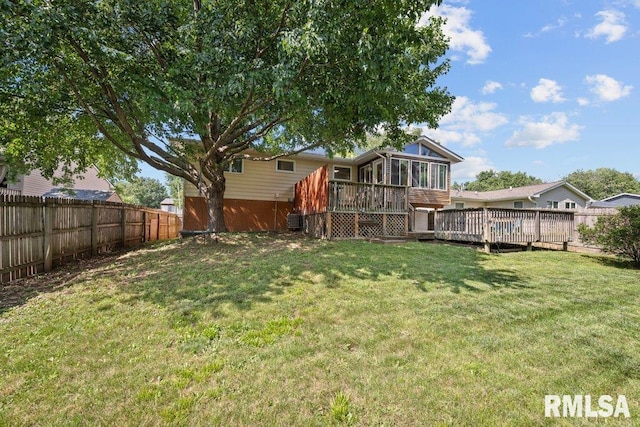 2917 W 65th St, Davenport, IA 52806 - fenced backyard featuring a sunroom and a deck