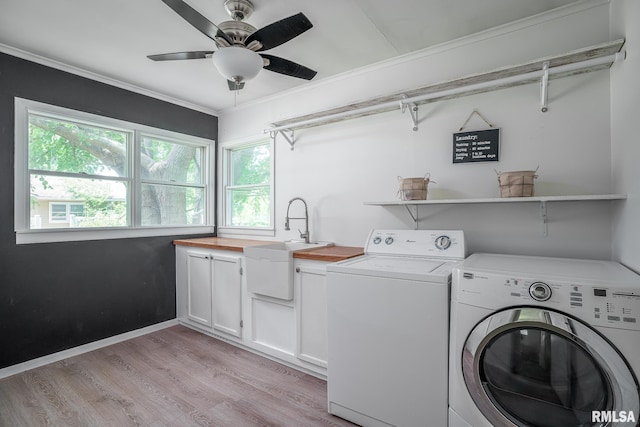 1715 65th Ave W, Rock Island, IL 61201 - washroom featuring washer and dryer, cabinet space, light wood finished floors, a ceiling fan, and ornamental molding