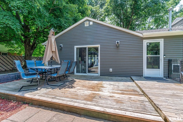 1715 65th Ave W, Rock Island, IL 61201 - wooden deck featuring outdoor dining space