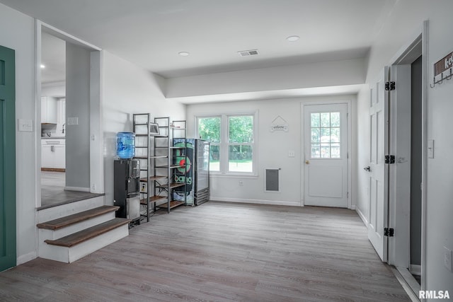 1715 65th Ave W, Rock Island, IL 61201 - foyer featuring wood finished floors, stairway, and recessed lighting