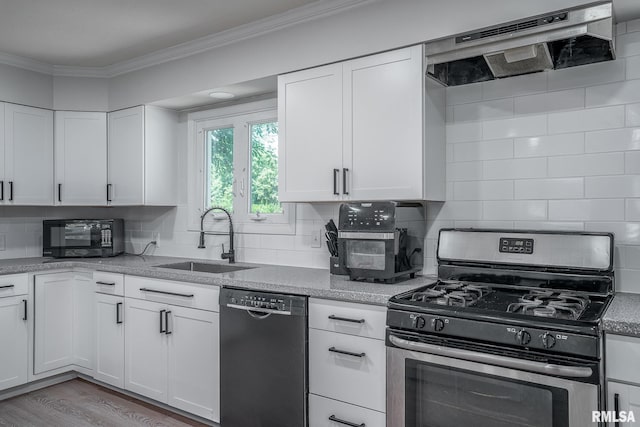 1715 65th Ave W, Rock Island, IL 61201 - kitchen featuring black appliances, ventilation hood, crown molding, white cabinets, and decorative backsplash