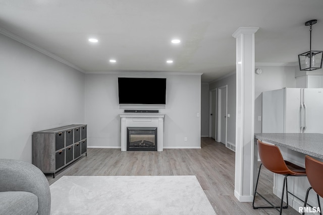 1715 65th Ave W, Rock Island, IL 61201 - living room featuring ornamental molding, light wood-style floors, recessed lighting, and a fireplace