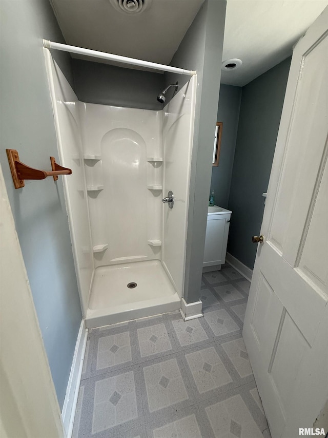 304 E Ames St, Yates City, IL 61572 - bathroom featuring a stall shower and tile patterned floors