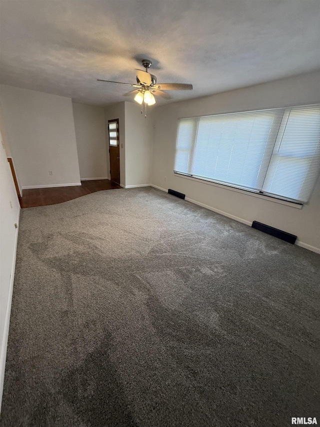 302 E Ames St, Yates City, IL 61572 - carpeted empty room featuring baseboards and ceiling fan