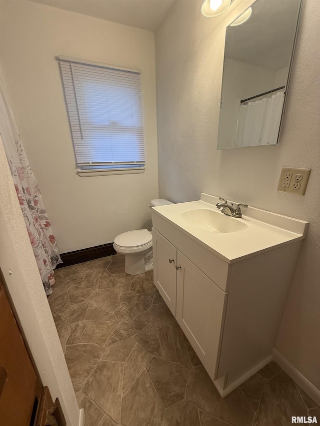 302 E Ames St, Yates City, IL 61572 - full bathroom featuring vanity and toilet