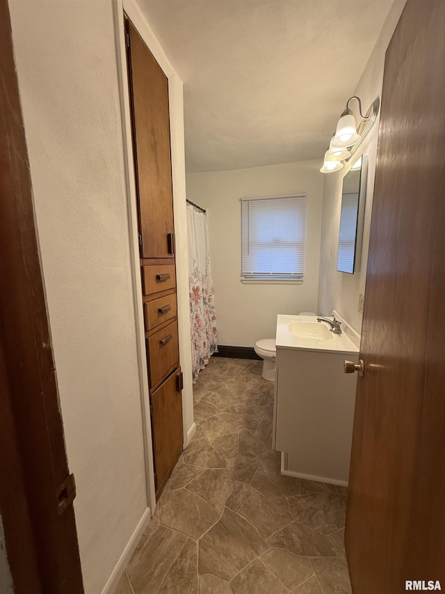 302 E Ames St, Yates City, IL 61572 - bathroom with vanity and toilet