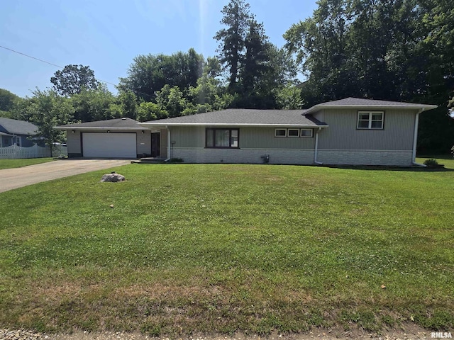 507 S Church St, Albany, IL 61230 - view of front of property featuring brick siding, a garage, concrete driveway, and a front yard