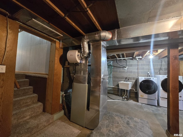507 S Church St, Albany, IL 61230 - unfinished below grade area featuring independent washer and dryer, heating unit, and stairway