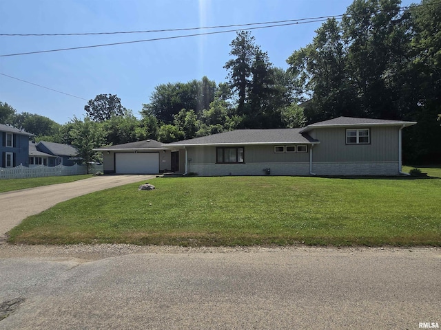 507 S Church St, Albany, IL 61230 - view of front of home with driveway, a garage, and a front lawn