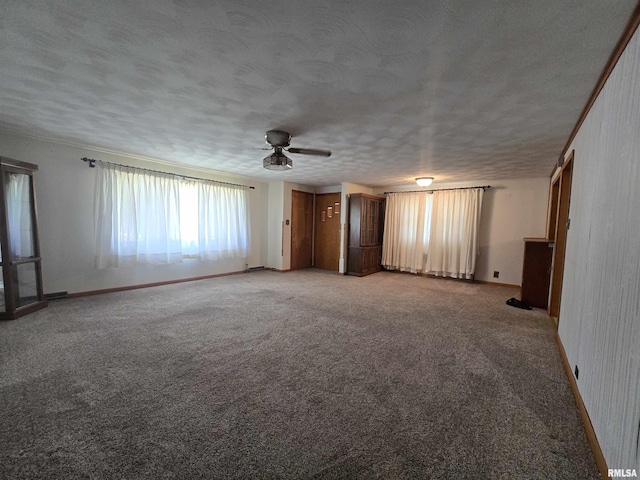 507 S Church St, Albany, IL 61230 - spare room with ceiling fan, light carpet, and a textured ceiling