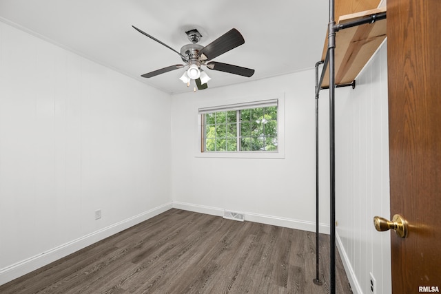 404 5th St, Sherrard, IL 61281 - unfurnished bedroom with dark wood finished floors and a ceiling fan
