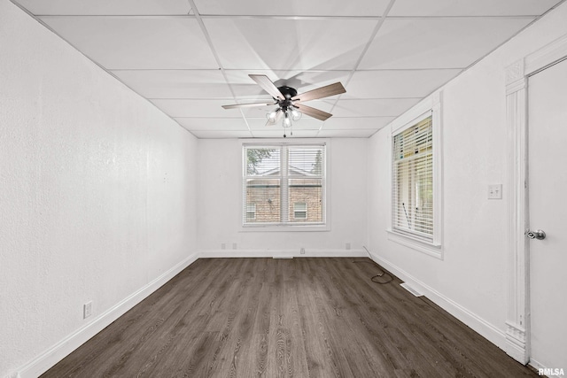 404 5th St, Sherrard, IL 61281 - empty room featuring dark wood-style floors, a ceiling fan, and a paneled ceiling